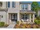 Welcoming front porch with double doors, comfortable seating, and stylish lighting fixtures on a brick home at 5003 Fairview Cir, Villa Rica, GA 30180