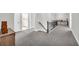 Spacious second floor hallway with a lovely railing and an entrance to a bathroom at 5003 Fairview Cir, Villa Rica, GA 30180