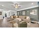 Cozy living room featuring stylish sofa and accent wall with decorative sconces at 5003 Fairview Cir, Villa Rica, GA 30180