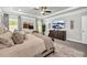 A spacious and well-decorated main bedroom with a large bed and a flat screen television at 5003 Fairview Cir, Villa Rica, GA 30180