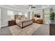 This is a spacious main bedroom with carpet flooring, a ceiling fan, and several windows at 5003 Fairview Cir, Villa Rica, GA 30180
