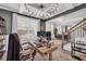 Office with coffered ceiling and modern light fixture adjacent to the foyer at 5003 Fairview Cir, Villa Rica, GA 30180