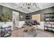 This office features a modern chandelier, wainscoting, neutral rug and dark green walls at 5003 Fairview Cir, Villa Rica, GA 30180