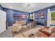 This bonus room features an accent wall, a desk area and comfortable seating arrangement at 5003 Fairview Cir, Villa Rica, GA 30180
