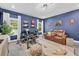 Office with accent wall, plenty of natural light, and a comfortable seating arrangement at 5003 Fairview Cir, Villa Rica, GA 30180