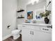 Stylish powder room with vanity, toilet, and decorative accents at 5003 Fairview Cir, Villa Rica, GA 30180