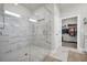 A glass-walled shower with marble tiling is located near the entrance to a walk-in closet at 5003 Fairview Cir, Villa Rica, GA 30180