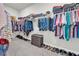 A fully loaded walk-in closet with a wide array of clothing and shoe storage at 5003 Fairview Cir, Villa Rica, GA 30180