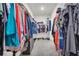 Walk-in closet with well-organized hanging clothes, shelves and shoe storage, and a central aisle at 5003 Fairview Cir, Villa Rica, GA 30180