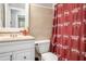 Bathroom featuring a vanity sink, modern fixtures, and a themed shower curtain at 6450 Ivey Se Rd, Mableton, GA 30126