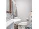 Simple bathroom with a white sink, wooden-framed mirror, and ample space at 6450 Ivey Se Rd, Mableton, GA 30126