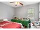 Bedroom with a bed, desk, and window providing natural light at 6450 Ivey Se Rd, Mableton, GA 30126