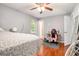 Bright bedroom with hardwood floors, desk, and comfortable layout at 6450 Ivey Se Rd, Mableton, GA 30126