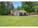 Charming single-story home with a two-car garage, wooden deck, and well-maintained lawn at 6450 Ivey Se Rd, Mableton, GA 30126