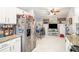 Bright kitchen with white cabinets, granite countertops, and modern appliances at 6450 Ivey Se Rd, Mableton, GA 30126