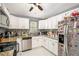 Stylish kitchen featuring white cabinets, granite counters, and stainless steel appliances at 6450 Ivey Se Rd, Mableton, GA 30126