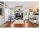 Well-lit living room with fireplace, hardwood floors, and an inviting ambiance at 6450 Ivey Se Rd, Mableton, GA 30126