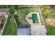 Beautiful backyard with pristine landscaping, mature trees, and outdoor pool with lounging area at 2668 Galahad Ne Dr, Atlanta, GA 30345