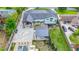 Aerial view of a residence with a backyard deck, pool, outdoor living area, and lush landscaping at 2668 Galahad Ne Dr, Atlanta, GA 30345