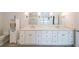 Bathroom featuring dual vanity, lots of storage, and modern fixtures at 2668 Galahad Ne Dr, Atlanta, GA 30345