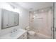 Stylish bathroom featuring a glass-enclosed shower with white subway tile and a modern vanity with elegant fixtures at 2668 Galahad Ne Dr, Atlanta, GA 30345