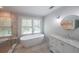 Bright bathroom with tub, shower, and marble vanity offering a relaxing and luxurious feel at 2668 Galahad Ne Dr, Atlanta, GA 30345
