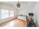 Bright bedroom with vaulted ceilings, hardwood floors, large windows, and a stationary bicycle for exercise at 2668 Galahad Ne Dr, Atlanta, GA 30345
