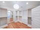 Walk-in closet featuring built-in shelving, drawers, and a full-length mirror at 2668 Galahad Ne Dr, Atlanta, GA 30345