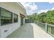 Spacious deck with white railing, offering a great view of the surrounding landscape and sky at 2668 Galahad Ne Dr, Atlanta, GA 30345