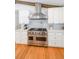 Gourmet kitchen featuring custom cabinetry, stainless steel appliances, and designer finishes at 2668 Galahad Ne Dr, Atlanta, GA 30345