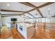 Spacious living room featuring hardwood floors, wood beams, and a bright, open floor plan at 2668 Galahad Ne Dr, Atlanta, GA 30345