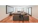 Inviting living room with a large sectional sofa, hardwood floors, and a projector screen for home entertainment at 2668 Galahad Ne Dr, Atlanta, GA 30345