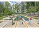 Stunning backyard pool area with modern lounge chairs, elegant planters, and lush landscaping for relaxation at 2668 Galahad Ne Dr, Atlanta, GA 30345