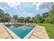 A stunning backyard pool with lounge chairs and a covered gazebo create an outdoor oasis at 2668 Galahad Ne Dr, Atlanta, GA 30345