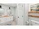 Bright bathroom featuring a double vanity, modern fixtures, and tile flooring at 45 Park Place Dr, Covington, GA 30016