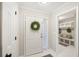Bright entryway with white door, wreath and mudroom access at 45 Park Place Dr, Covington, GA 30016