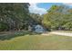 Beautiful single story home with a green lawn and plenty of surrounding trees at 45 Park Place Dr, Covington, GA 30016