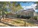 The exterior features a deck with an attached screened in porch, nicely situated and shaded by mature trees at 45 Park Place Dr, Covington, GA 30016