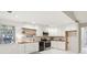 Well-lit kitchen with butcher block counters and stainless steel appliances at 45 Park Place Dr, Covington, GA 30016