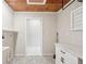 Laundry room with custom tile flooring and a wood paneled ceiling at 45 Park Place Dr, Covington, GA 30016