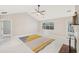 Open living room with fireplace and large windows providing lots of light at 45 Park Place Dr, Covington, GA 30016