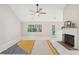 Bright living room with fireplace, area rug, and open access to back patio at 45 Park Place Dr, Covington, GA 30016