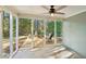 Relaxing screened porch with ceiling fan, perfect for enjoying the outdoors, in the sunroom, with outdoor views at 45 Park Place Dr, Covington, GA 30016