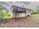 Back of home showcasing a wooden deck, siding, and partial view of the yard at 5340 The Savoy St, Atlanta, GA 30349
