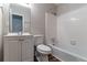 This bathroom includes a vanity, mirror, toilet, and tub with shower at 5340 The Savoy St, Atlanta, GA 30349