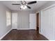 Simple bedroom featuring hardwood floors, two closets, and a ceiling fan at 5340 The Savoy St, Atlanta, GA 30349