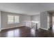 Spacious living room with hardwood floors, natural light, and staircase at 5340 The Savoy St, Atlanta, GA 30349