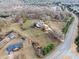 Aerial view of estate with spacious land, complemented by a horse area and neighborhood at 401 Nichols Dr, Suwanee, GA 30024
