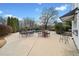 Spacious backyard patio with pool, dining area, and outdoor bar for entertaining at 401 Nichols Dr, Suwanee, GA 30024