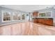 Basement wet bar with stainless fridge, wooden cabinets and view of the backyard at 401 Nichols Dr, Suwanee, GA 30024